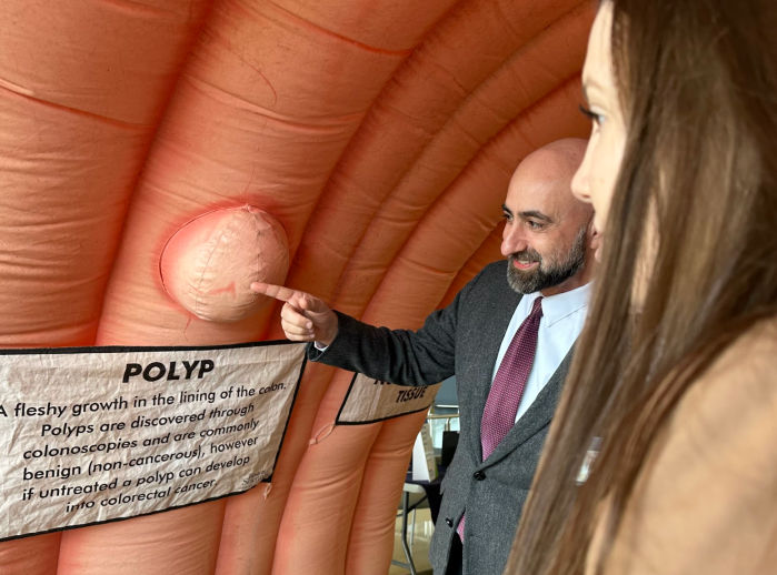 Chief of colorectal surgery Dr. John Ricci points to a polyp on the inflatable colon